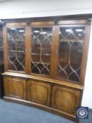 A good quality inverted bowed mahogany glazed bookcase