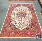 An Isfahan rug 210 cm x 138 cm.