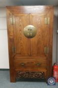 A Chinese elm double door cabinet,