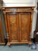 A nineteenth century burr walnut double door cabinet, width 95 cm.