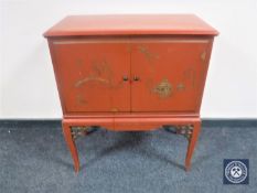 A Chinoiserie double door low cabinet
