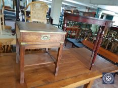 A D-shaped hall table and a brass mounted leather topped occasional table