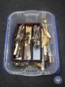 A box containing a cutlery tray and assorted loose cutlery