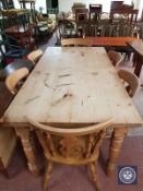 A pine refectory dining table and six chairs