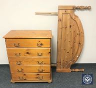 A pine chest of five drawers and similar headboard