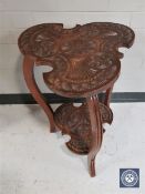A carved oak shaped top occasional table