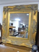 An ornate Victorian style gilt mirror