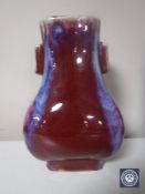 A Chinese Sang De Boeuf flambe fanghu vase with character mark to base, height 26.5 cm.