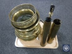 A tray of embossed brass planters, ammunition shells,