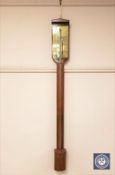 A continental mahogany stick barometer, height 94 cm.