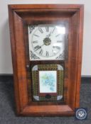 A continental oak cased wall clock