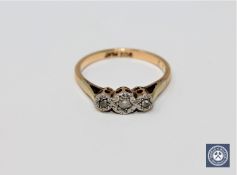 A 9ct gold platinum set three stone diamond ring