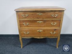 A continental pine three drawer chest