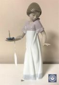 A Nao figurine - Girl holding candle, height 26 cm.