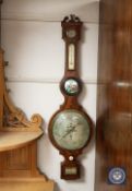 A late nineteenth century banjo barometer, silvered dial signed C. Riva, Glasgow, height 110 cm.