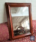 An early 20th century walnut framed mirror