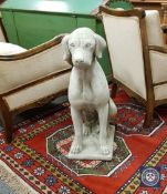 A pair of composition figures of seated dogs, height 72 cm.