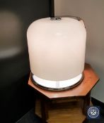 A mid twentieth century white plastic and polished steel table lamp,