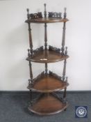 A Victorian style mahogany four-tier corner whatnot stand