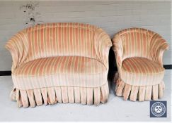 An early 20th century shaped settee and matching chair in striped upholstery