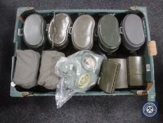 A box of militaria to include gas mask, gun cleaning kits,