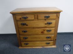 A pine six drawer chest with metal drop handles