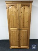 A pine double door wardrobe