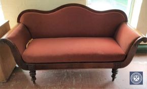 A 19th century continental mahogany scroll arm settee