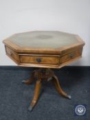 A mahogany octagonal occasional table with tooled leather top