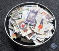 A tin containing a large quantity of Player's cigarette cards