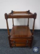 A mahogany two-tier occasional table fitted two drawers