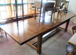 An oak extending refectory dining table CONDITION REPORT: 95cm wide. Extended 320cm.