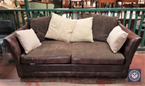 A Barker & Stonehouse "Wallace" brown leather three seater drop end settee with scatter cushions