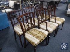 A set of six mahogany dining chairs upholstered in gold brocade