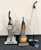 A Dyson DC 24 upright vacuum cleaner,