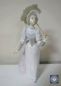 A Lladro figure of a lady holding a parasol,