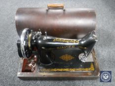 A mahogany cased Singer hand sewing machine