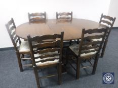 A circular oak pedestal dining table with leaf together with a set of six tapestry seated ladder