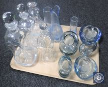 A tray containing Holmegaard blue glass ware and Holmegaard decanters
