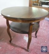 An oak two tier occasional table