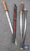 A replica Japanese katana and a Chinese sword,