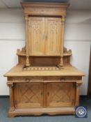 A nineteenth century carved oak sideboard cabinet, width 157 cm.