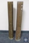 Two large brass shell cases