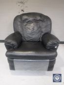 A black leather manual reclining armchair