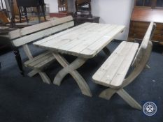 A pine garden table on X-frame support,