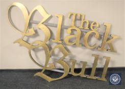 A large gilt pub sign, 'The Black Bull',