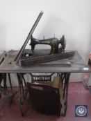A Jones treadle sewing machine in oak table