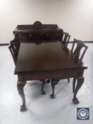 A Victorian style mahogany pull out dining table on claw and ball feet,