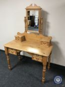 A pine dressing table with mirror back
