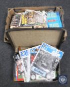 A box and a briefcase containing a large collection of football programmes,